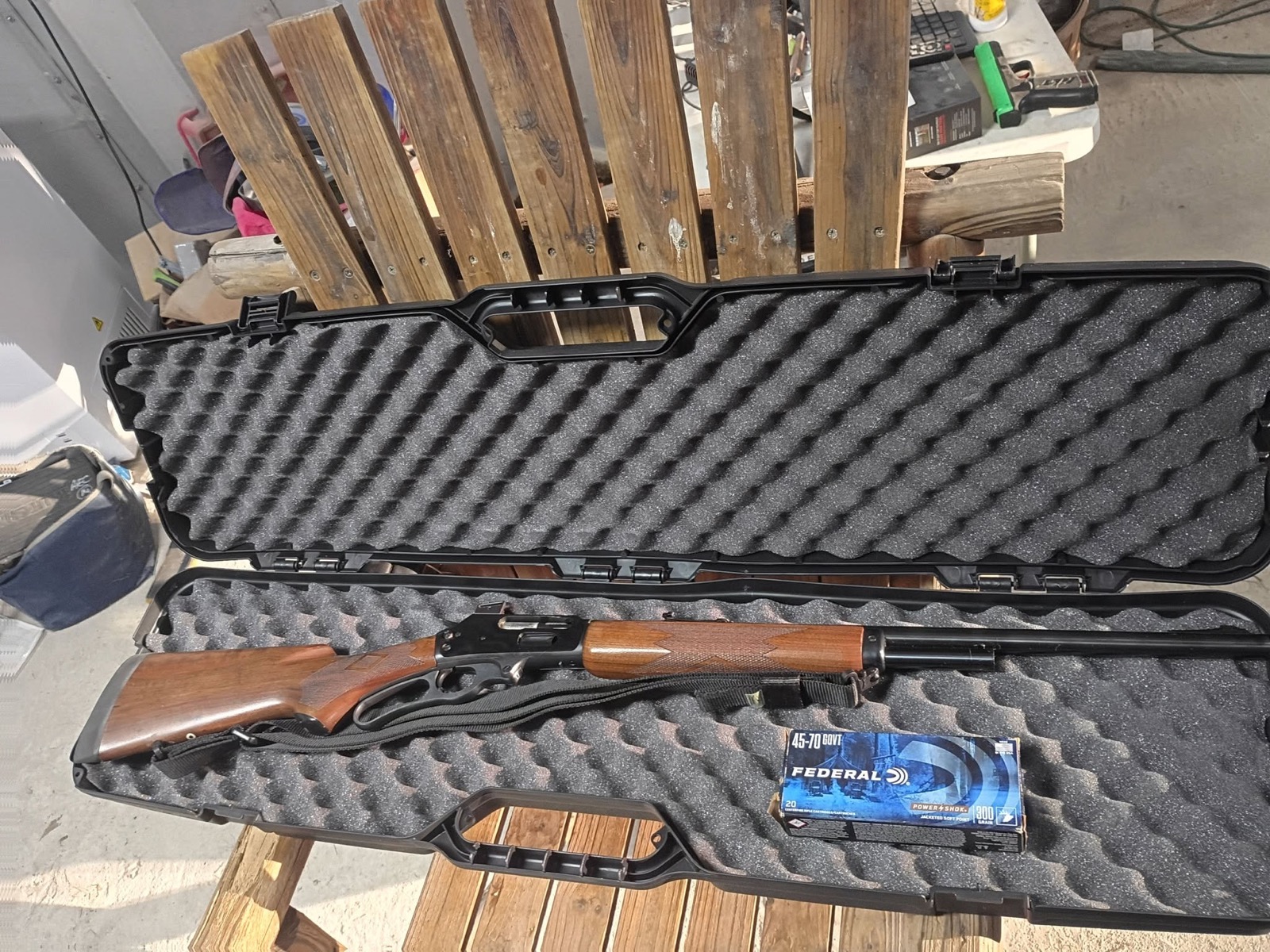 Lever action rifle in case with ammunition